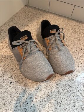 New Balance women’s Gray Knit Sneakers with Brown Accents
